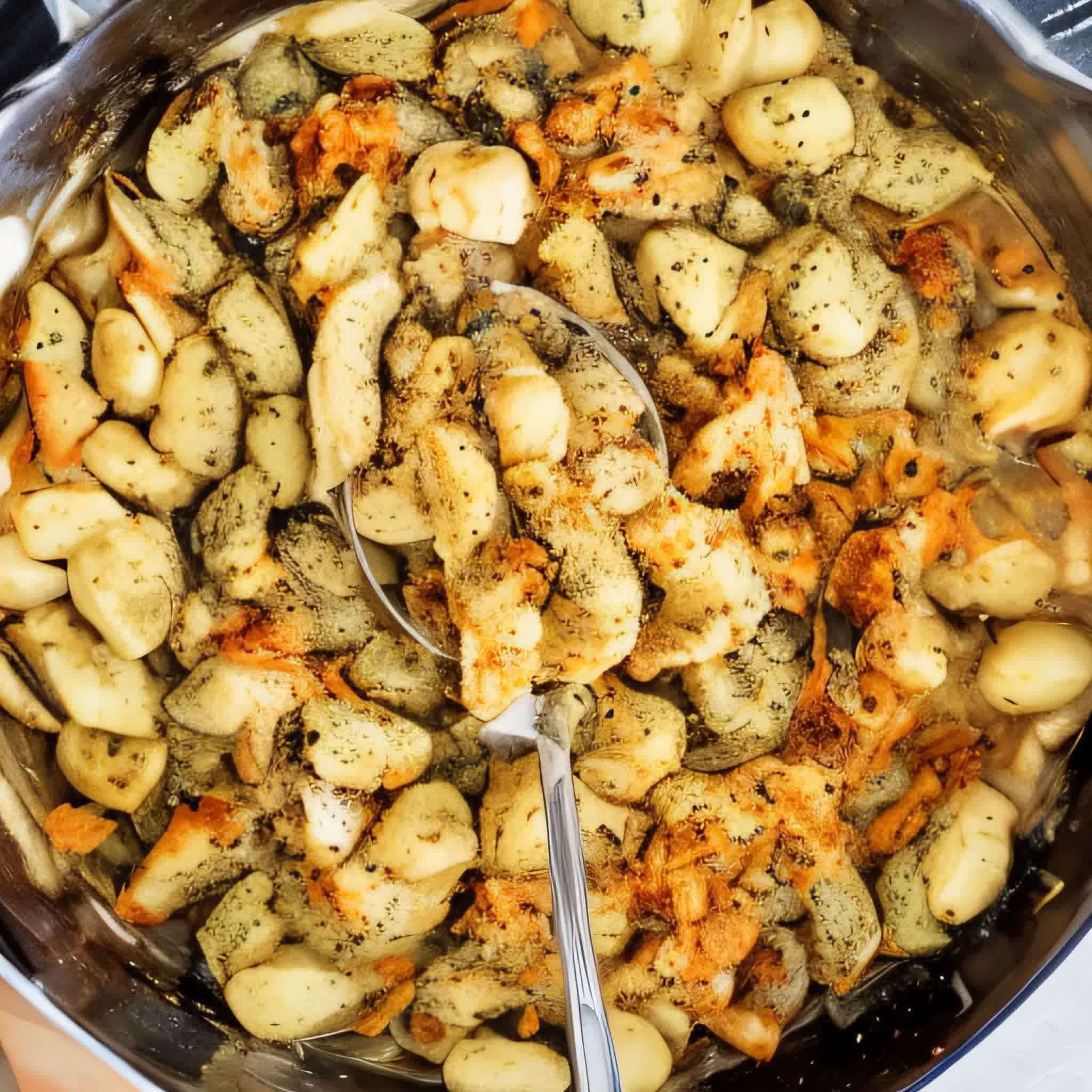 garlic butter chicken gnocchi in a black cast iron skillet.